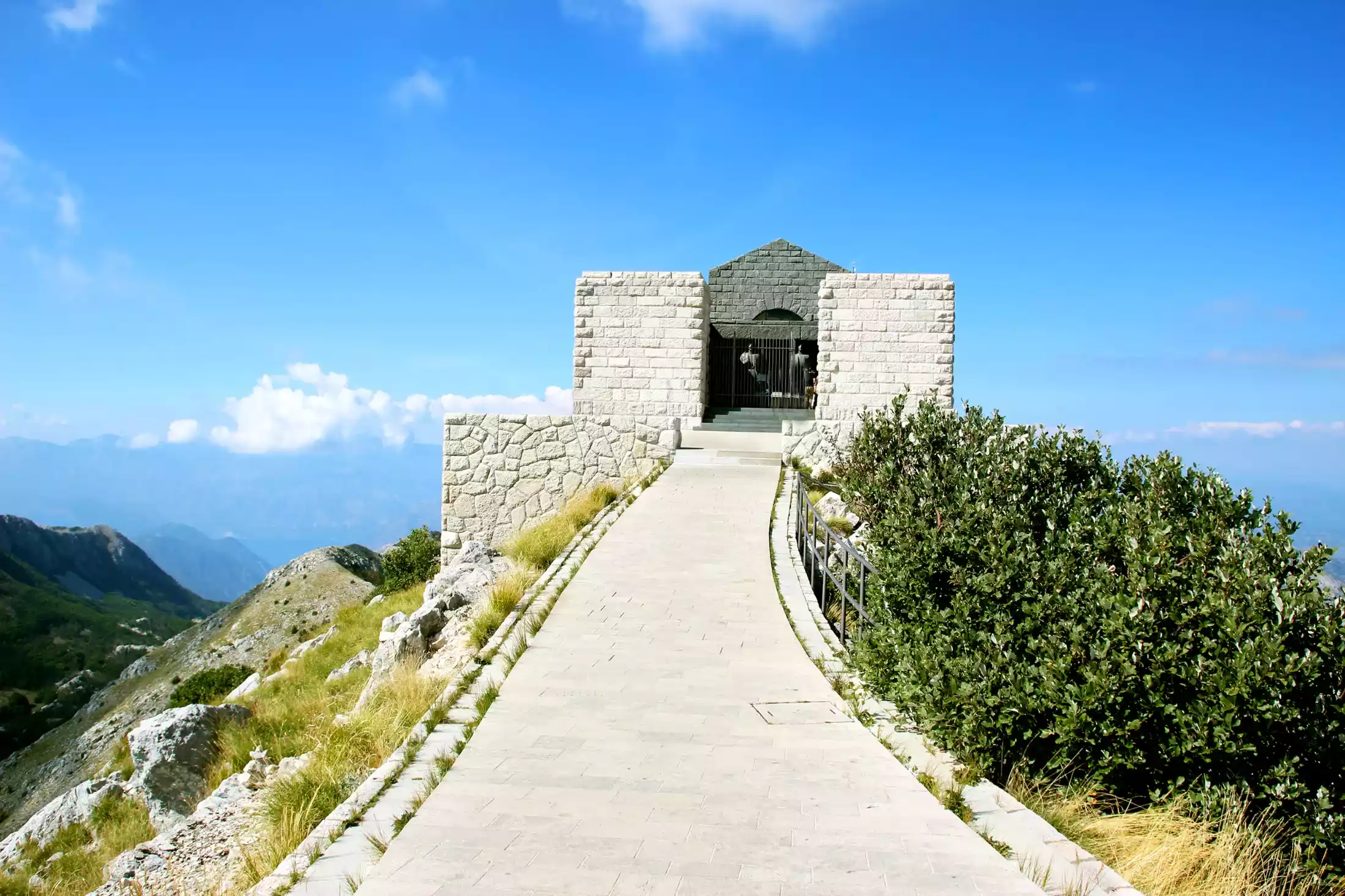 The prominent Njegoš Mausoleum perched atop Mount Lovćen, offering a panoramic vista of Montenegro's diverse landscape.